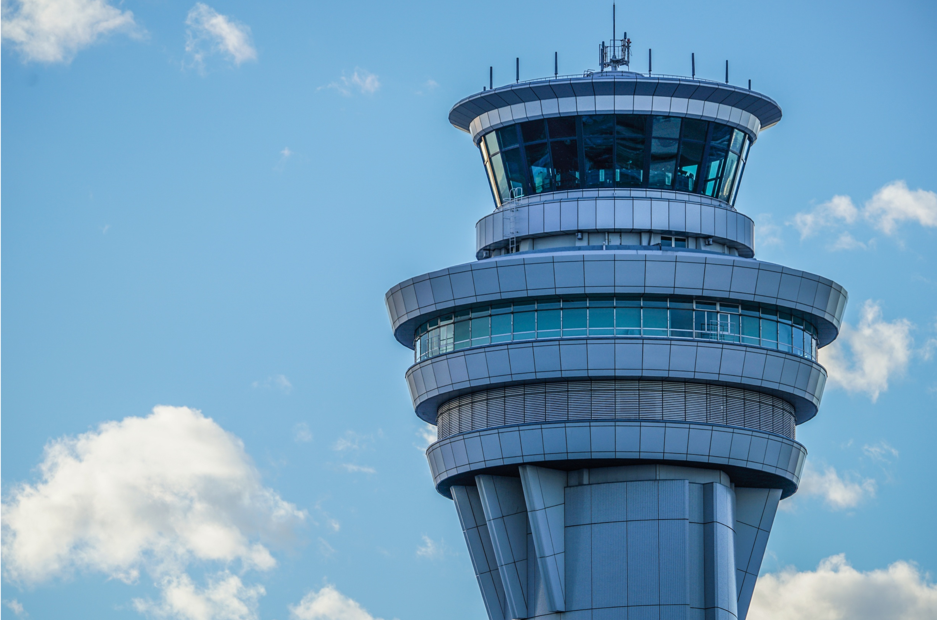 Air traffic control tower against a blue sky